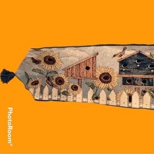 Tapestry table runner with sunflowers, birdhouses & birds. Tassels on each end.